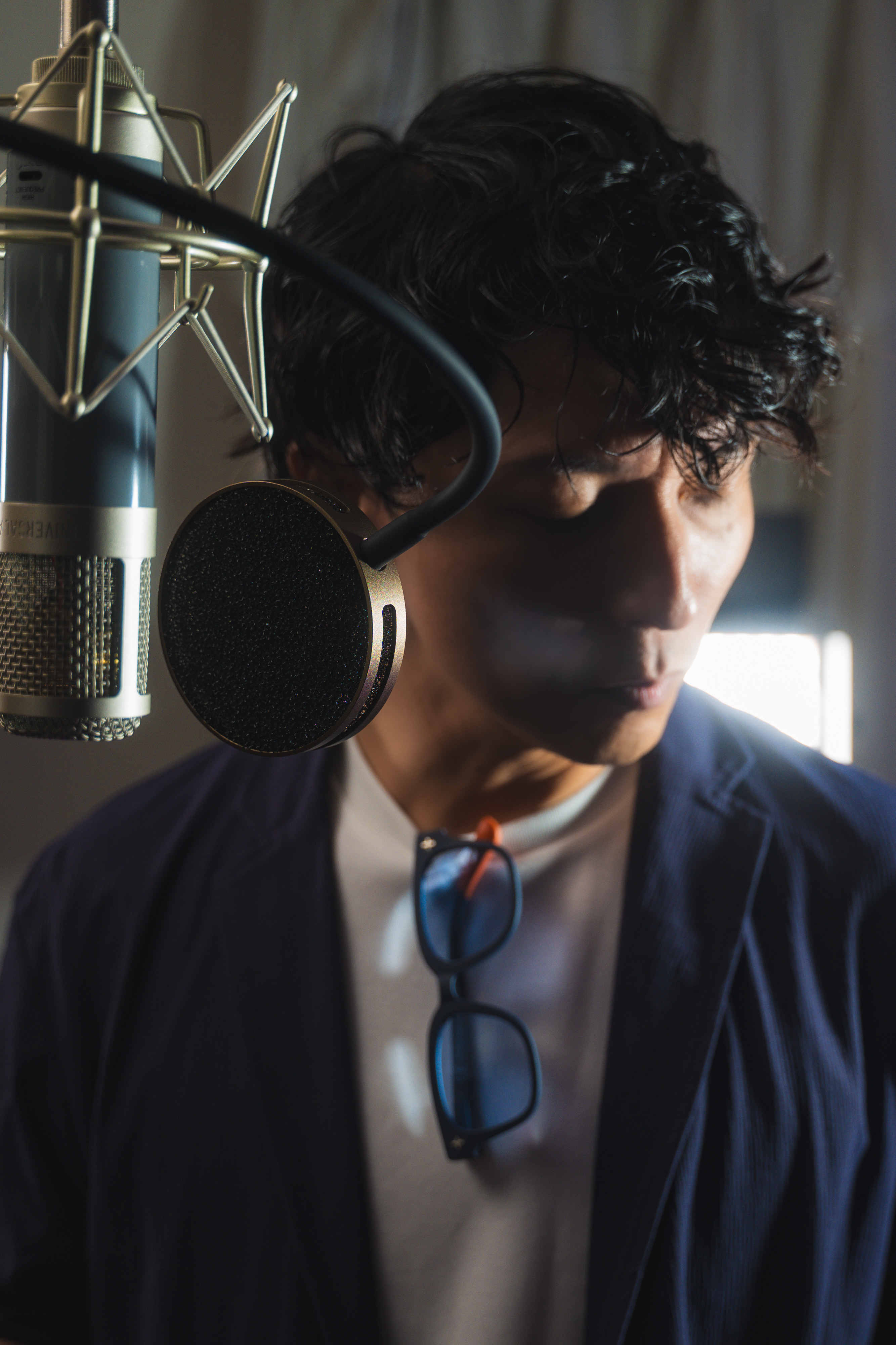 Nobua recording vocals in a studio